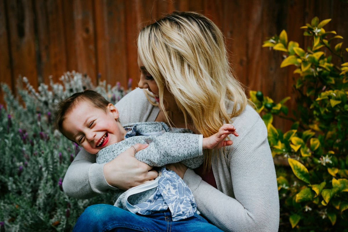 Happy mom and toddler daughter